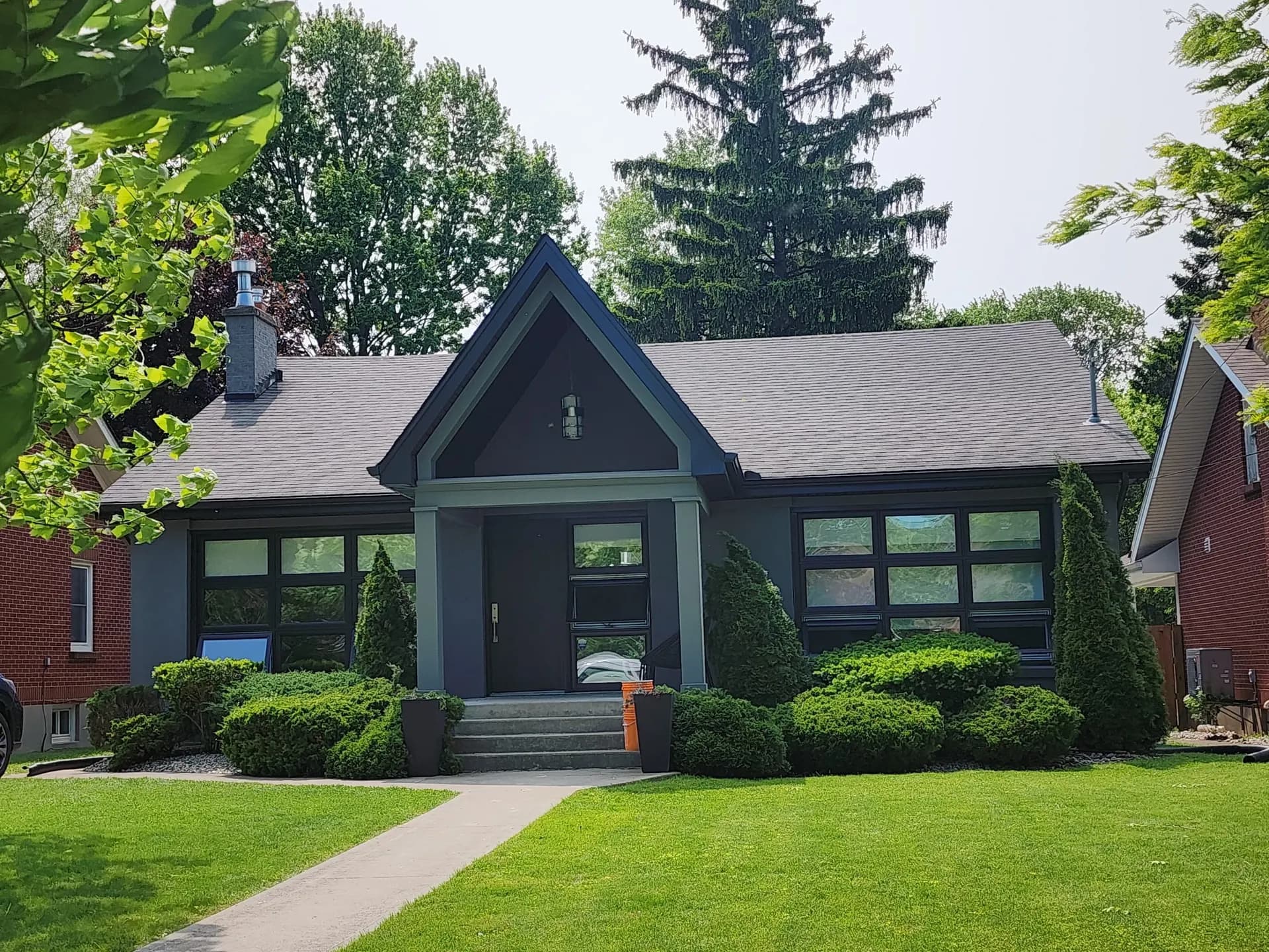 Bungalow with dark charcoal stucco and trim
